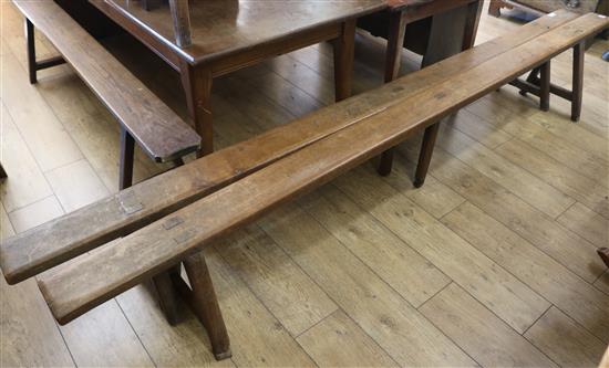 A pair of 19th century French fruitwood bench seats, L.288cm